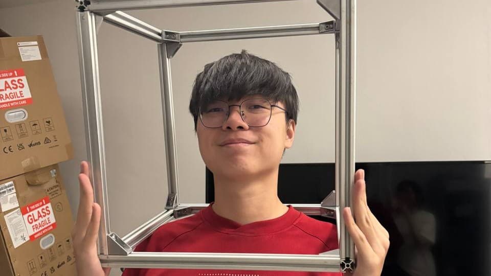 Autoscope head mechanical engineer holding Autoscope frame over head